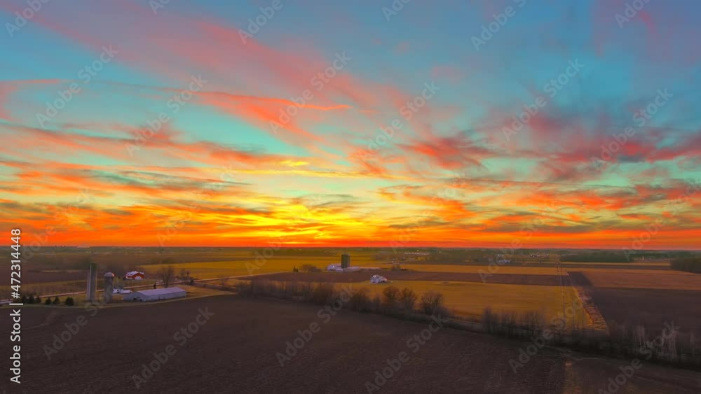 Incredibly beautiful, fiery red sky over rural agricultural landscape, aerial view.
Incredibly beautiful, fiery red sky over rural agricultural landscape, aerial view.
