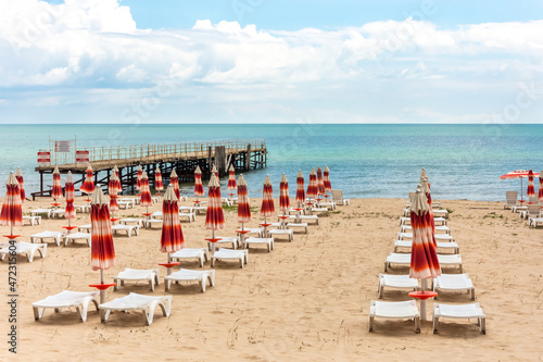 View of beach chairs and umbrellas on the beach 