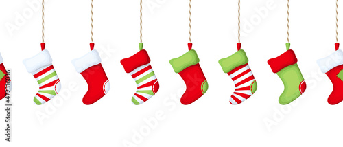 Vector horizontal seamless border with hanging colorful Christmas socks on a white background.