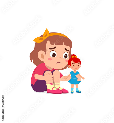cute girl play toy doll alone and feel sad