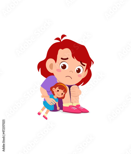 cute girl play toy doll alone and feel sad