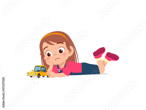 cute girl play toy car alone and feel sad