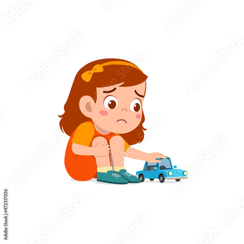 cute girl play toy car alone and feel sad