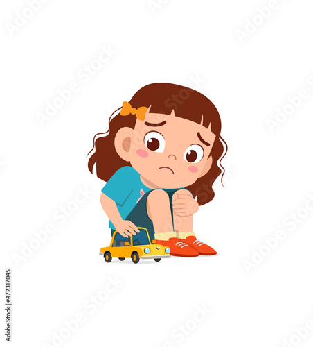 cute girl play toy car alone and feel sad