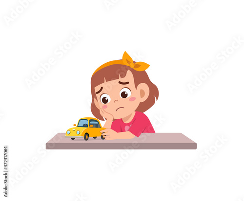 cute girl play toy car alone and feel sad