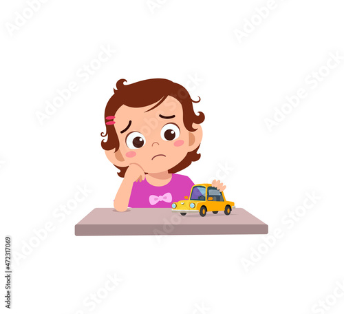cute girl play toy car alone and feel sad