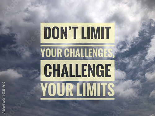 Motivational quote written with phrase DON'T LIMIT YOUR CHALLENGES, CHALLENGE YOUR LIMITS