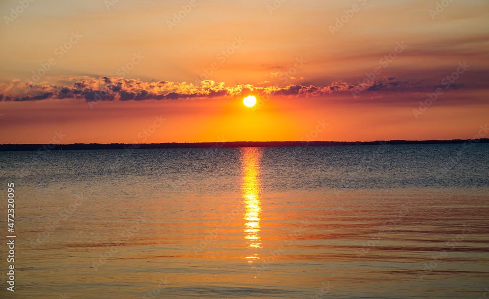 Naklejka premium sunset over the river 