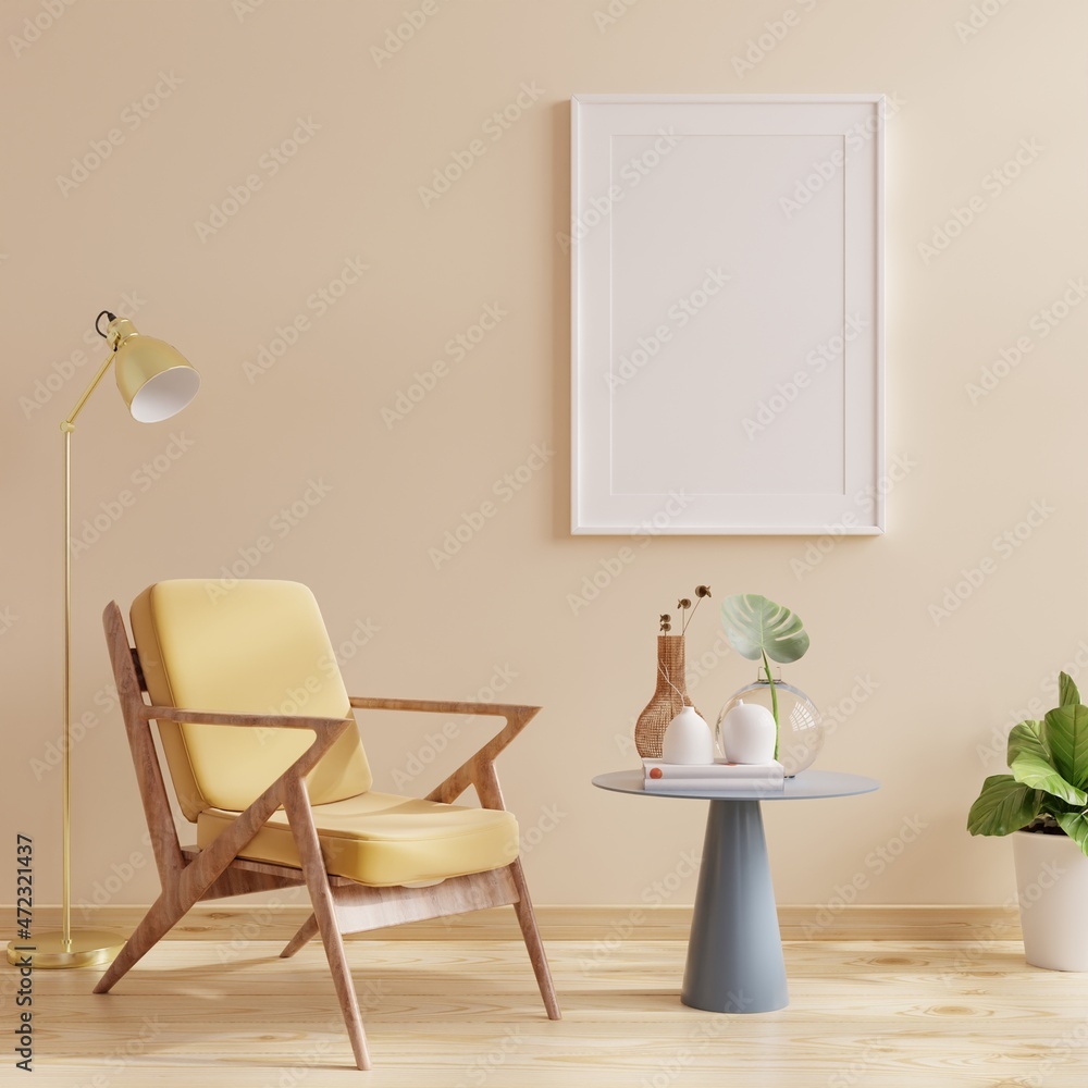 Poster frame mockup with vertical frames on empty cream color wall with yellow velvet armchair. Poster frame mockup with vertical frames on empty cream color wall with yellow velvet armchair.