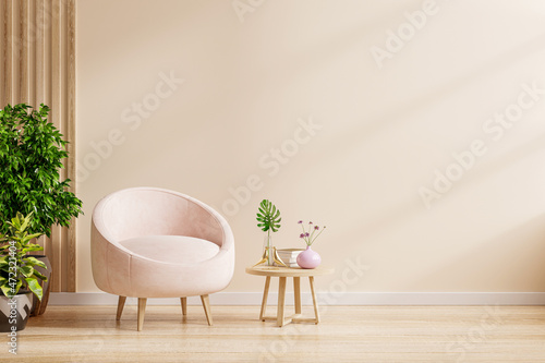 Modern interior with an armchair on empty cream color wall background.