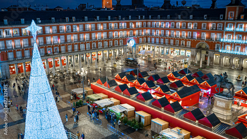 Stalls of the Christmas Market in the Plaza Mayor of the city of Madrid, with Christmas lighting photo