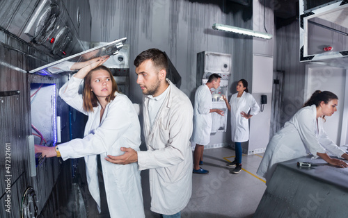 Group of adults trying to get out of the escape room stylized under the laboratory