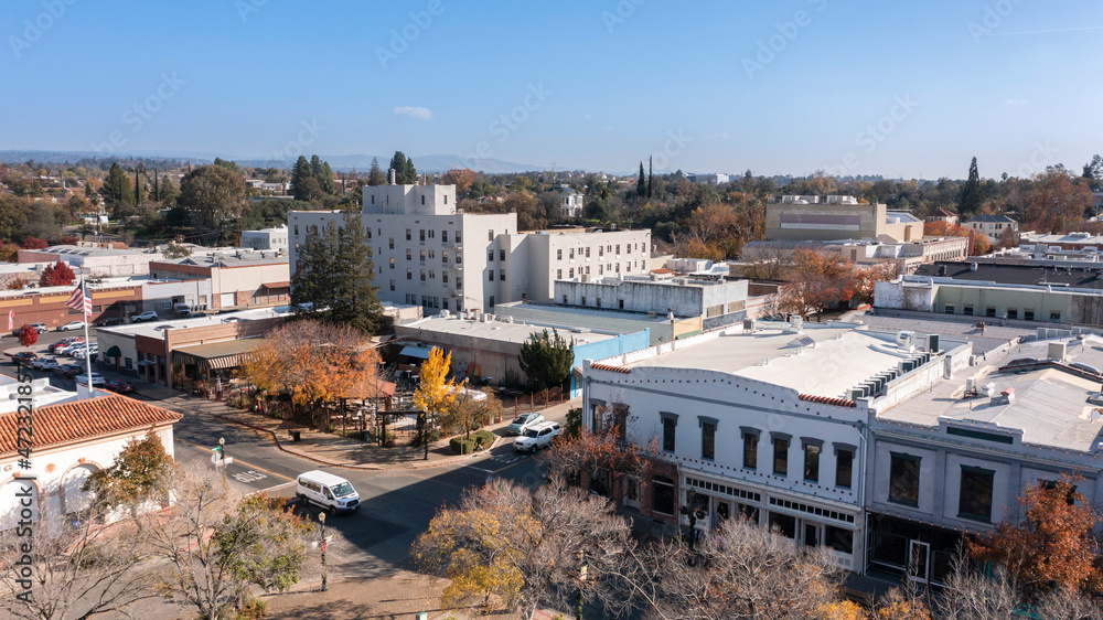Oroville, California, USA - November 23, 2021: Late afternoon sun shines on historic gold rush era downtown architecture. - obrazy, fototapety, plakaty 
