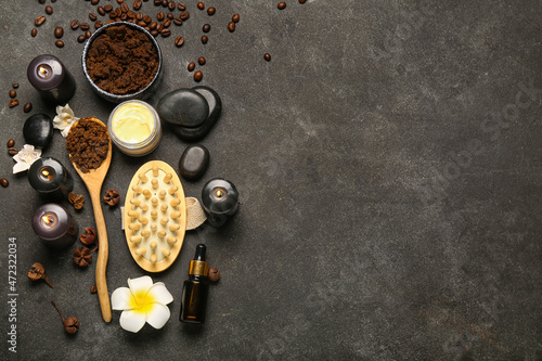 Beautiful spa composition with burning candles and coffee beans on dark background