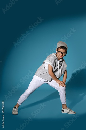 Dancing little boy on color background © Pixel-Shot