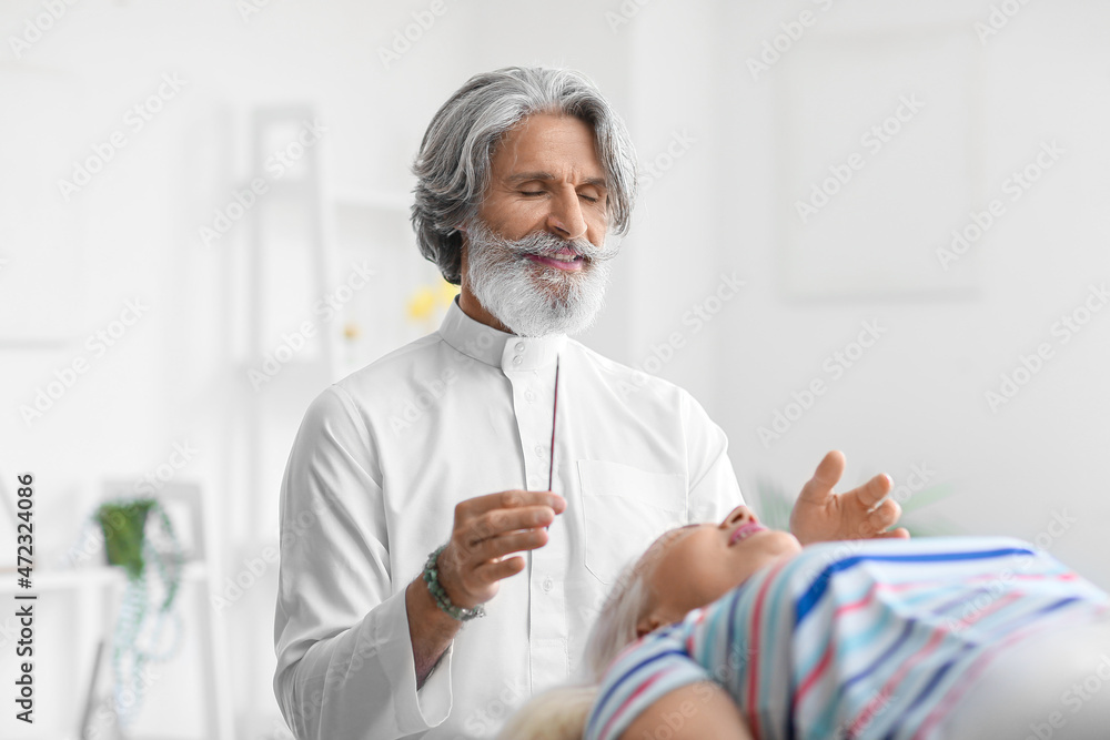 Fototapeta premium Reiki master working with patient