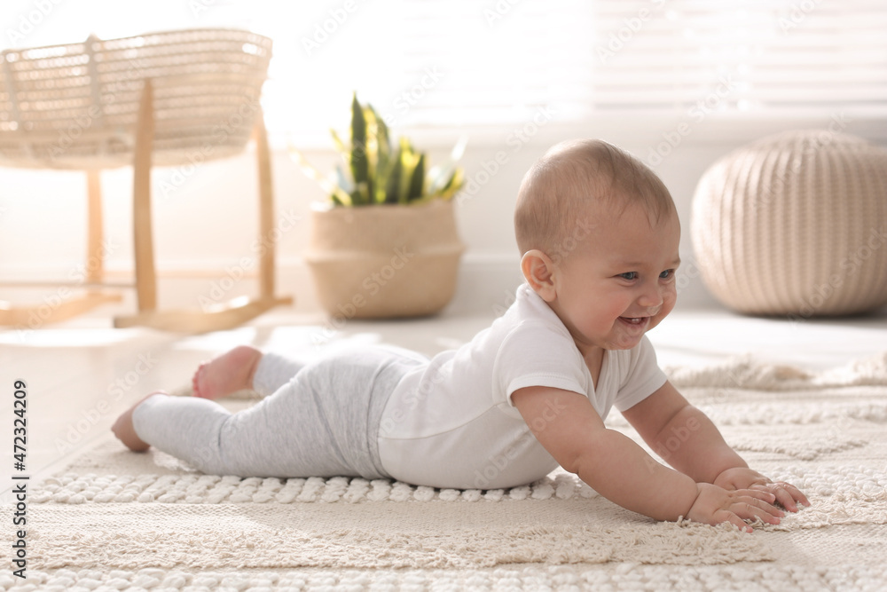 Cute baby crawling on floor at home Cute baby crawling on floor at home