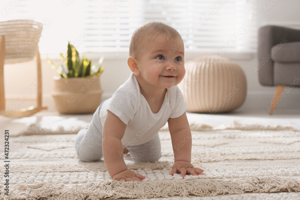 Cute baby crawling on floor at home Cute baby crawling on floor at home