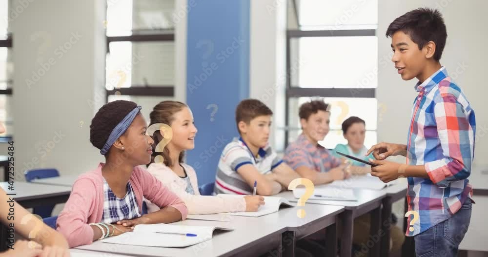 Animation of question marks over male student using tablet with diverse classmates in classroom Animation of question marks over male student using tablet with diverse classmates in classroom