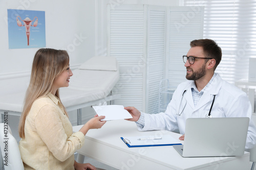 Young woman having appointment with gynecologist in clinic