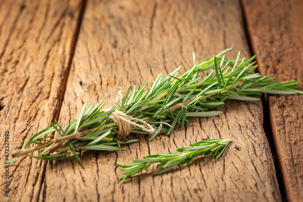 Fresh rosemary herb on the table. Fresh rosemary herb on the table.
