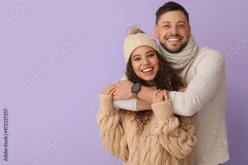 Happy hugging couple in win...