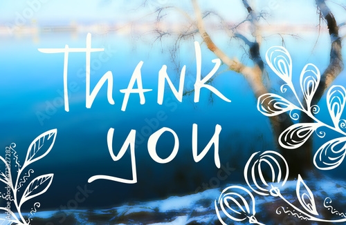 Thank you - phrase. White hand drawing lettering and floral elements on Background. Nature Winter water Landscape Photo