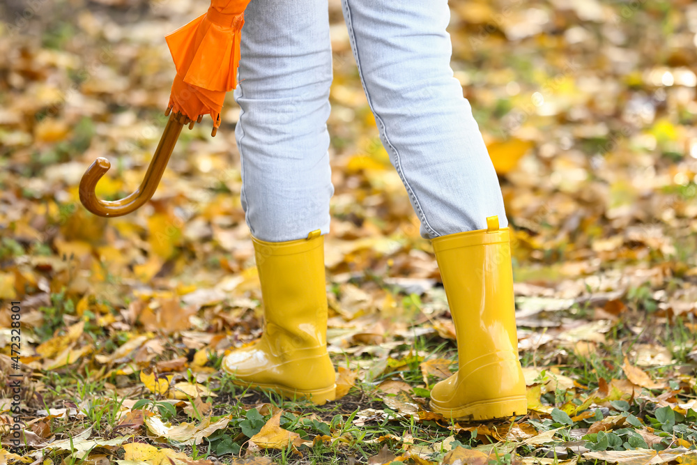 yellow gumboots walking outdoors Stock 