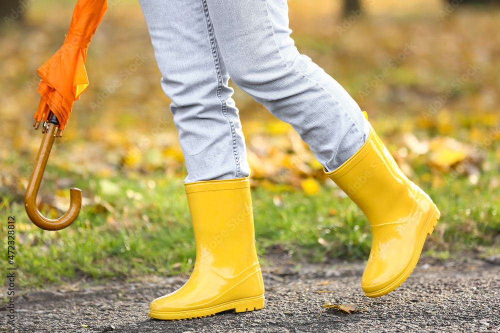 yellow gumboots walking outdoors Stock 