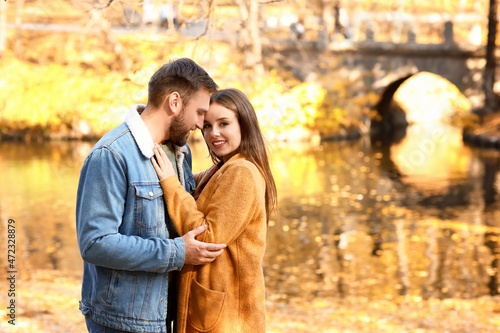Loving couple hugging in be...