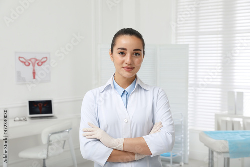 Portrait of beautiful young gynecologist in clinic