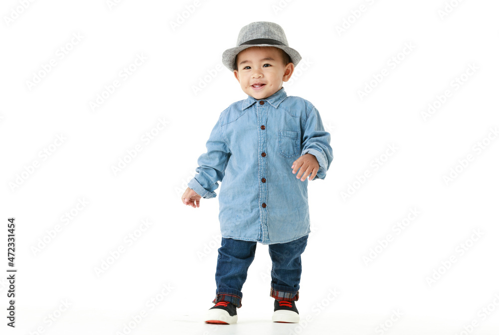 Lovely portrait of cute Asian little boy smiling on smart hat and handsome outfit with happy to play outdoors. Lovely portrait of cute Asian little boy smiling on smart hat and handsome outfit with happy to play outdoors.