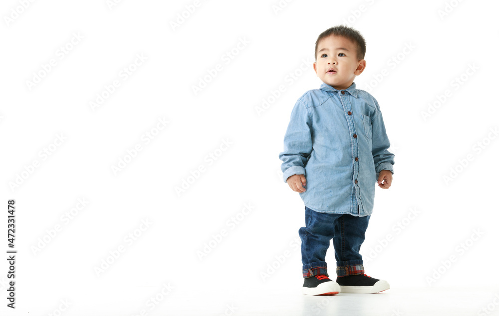 Handsome little Asian boy on long sleeved shirt for smart outfit standing with confident and sparkling eyes, chin up, and smile for hopeful expectation of beautiful childhood lifestyle. Handsome little Asian boy on long sleeved shirt for smart outfit standing with confident and sparkling eyes, chin up, and smile for hopeful expectation of beautiful childhood lifestyle.