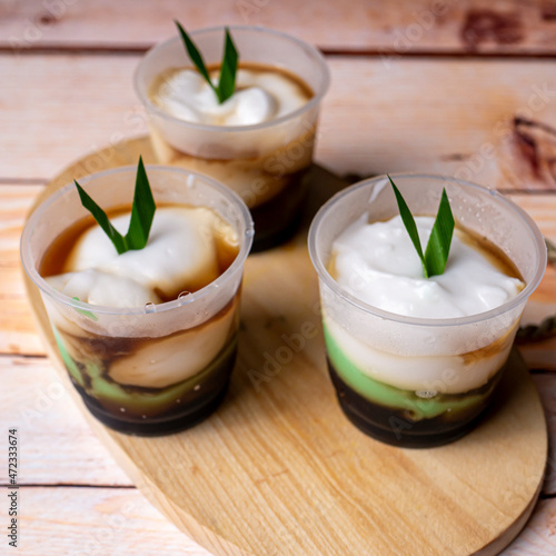 Lapis or Bubur Jongkong Indonesia's sweet porridge of rice flour, coconut milk and palm sugar syrup photo