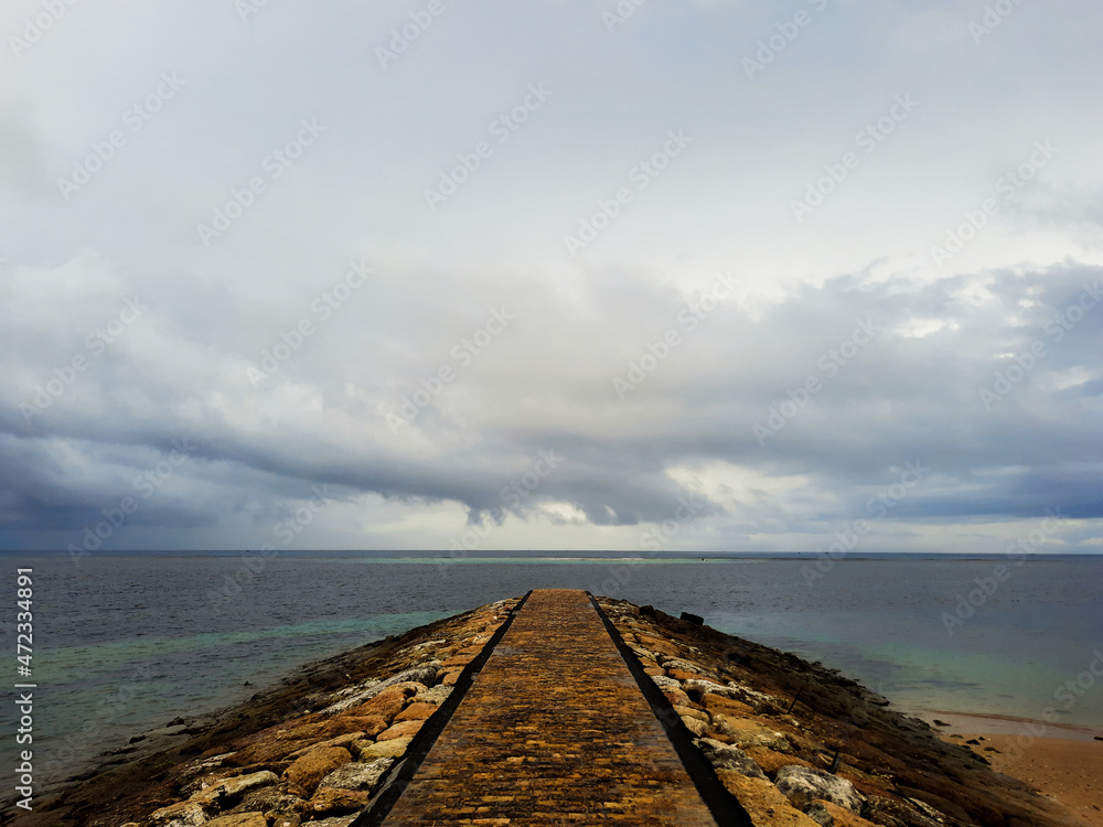 Path to the sea when the weather is cloudy