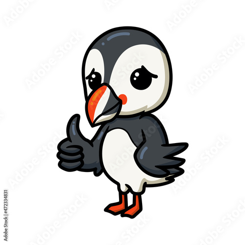 Cute little puffin bird cartoon giving thumb up