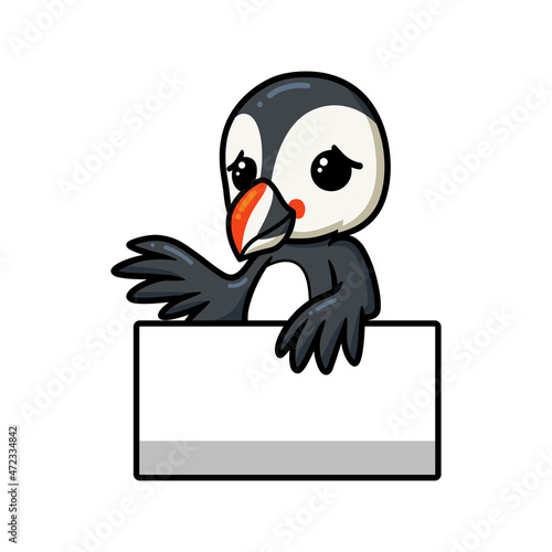 Cute little puffin bird cartoon with blank sign