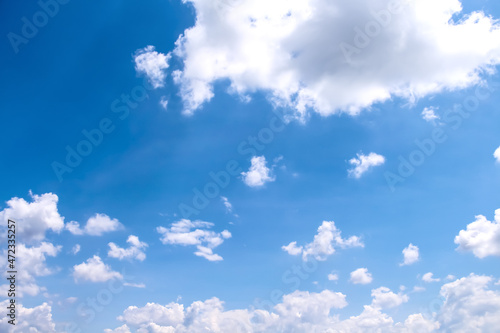 Summer clouds patterns on bright blue sky background