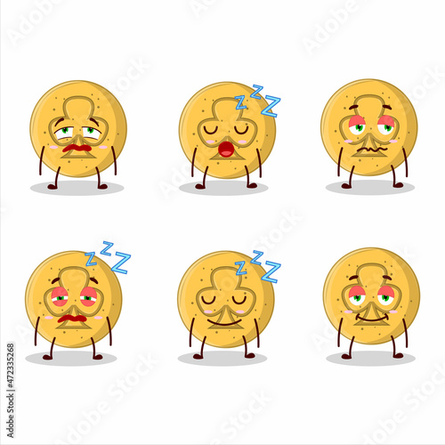 Cartoon character of dalgona candy trefoils with sleepy expression