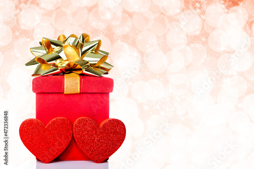 Red Gift Box With Hearts and Glittering Background