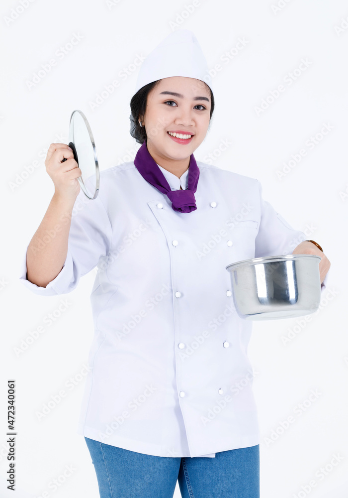 Portrait studio shot of Asian professional restaurant cooking female executive chef in cook uniform and scarf standing smiling look at camera holding stainless pot and cover on white background Portrait studio shot of Asian professional restaurant cooking female executive chef in cook uniform and scarf standing smiling look at camera holding stainless pot and cover on white background