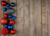 Christmas balls with different colors on the rustic wooden background. Shot from above. Christmas background.