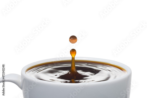 White cup with one drop coffee splash.on white background.