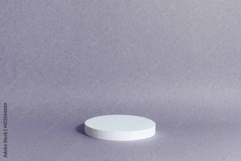 Minimal abstract background for the presentation of a cosmetic product. White scene on a lilac background. Premium podium, showcase, display case.