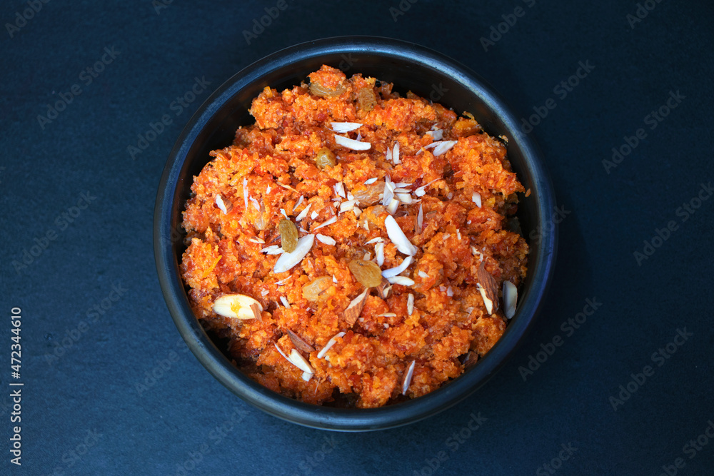 Gajar ka halwa, carrot halwa is a carrot-based sweet dessert pudding from the Indian subcontinent. - obrazy, fototapety, plakaty 