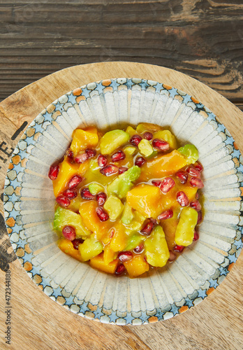 Mango salad with avocado and pomegranate seeds. French gourmet cuisine