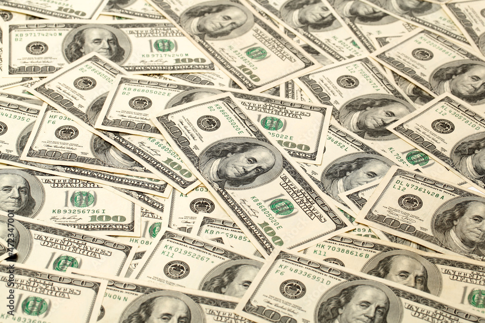 Many bundle of US 100 dollars bank notes isolated on white background Many bundle of US 100 dollars bank notes isolated on white background