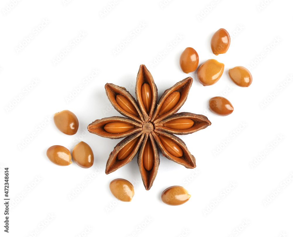 Dry anise star with seeds on white background, top view