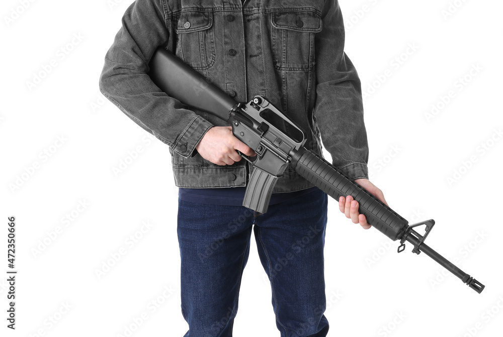 Assault gun. Man holding rifle on white background, closeup Assault gun. Man holding rifle on white background, closeup