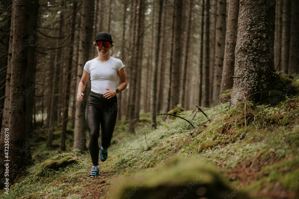Fit female jogger training for cross country forest trail race in nature  park. Young female athlete jogging in mountains. Runner doing morning  physical training. Photos | Adobe Stock